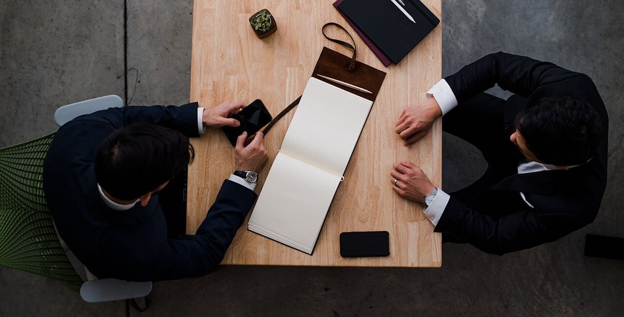 attorney sitting across table from client